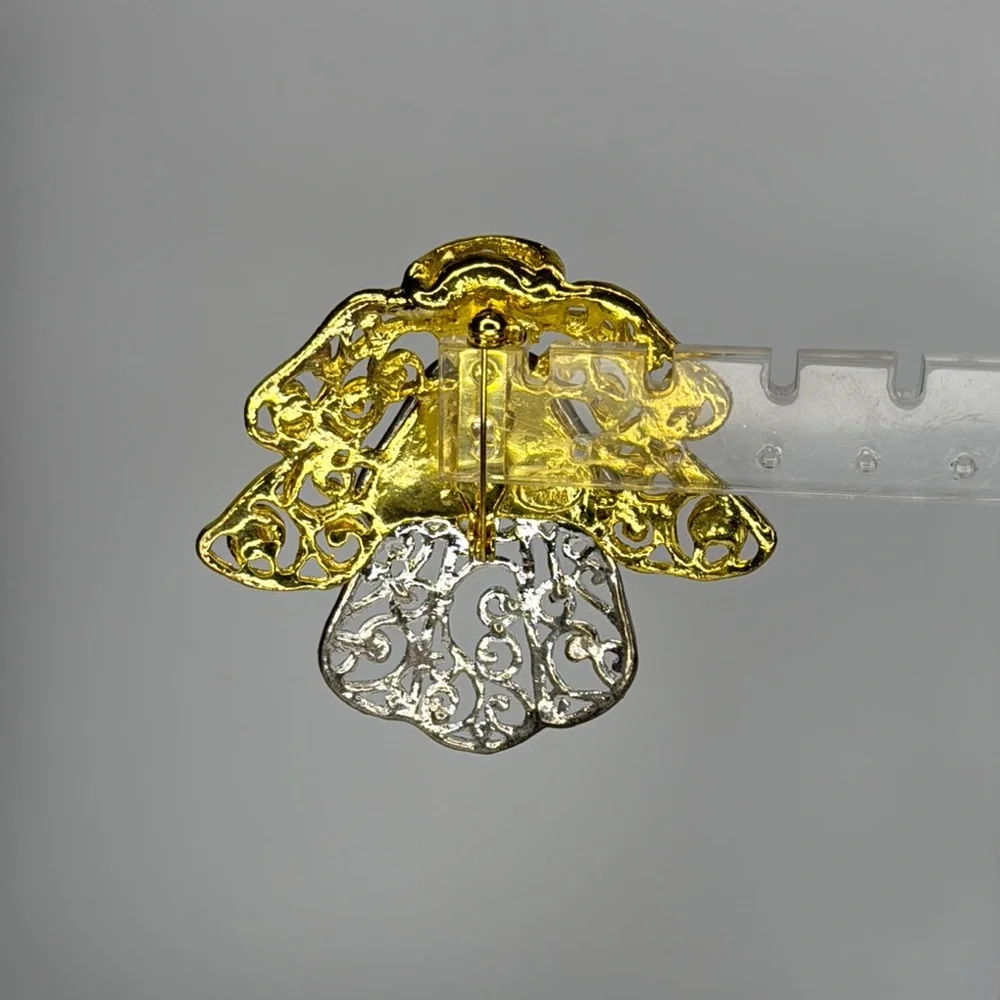 Elegant Gold and Silver Angel Brooch with Intricate Filigree